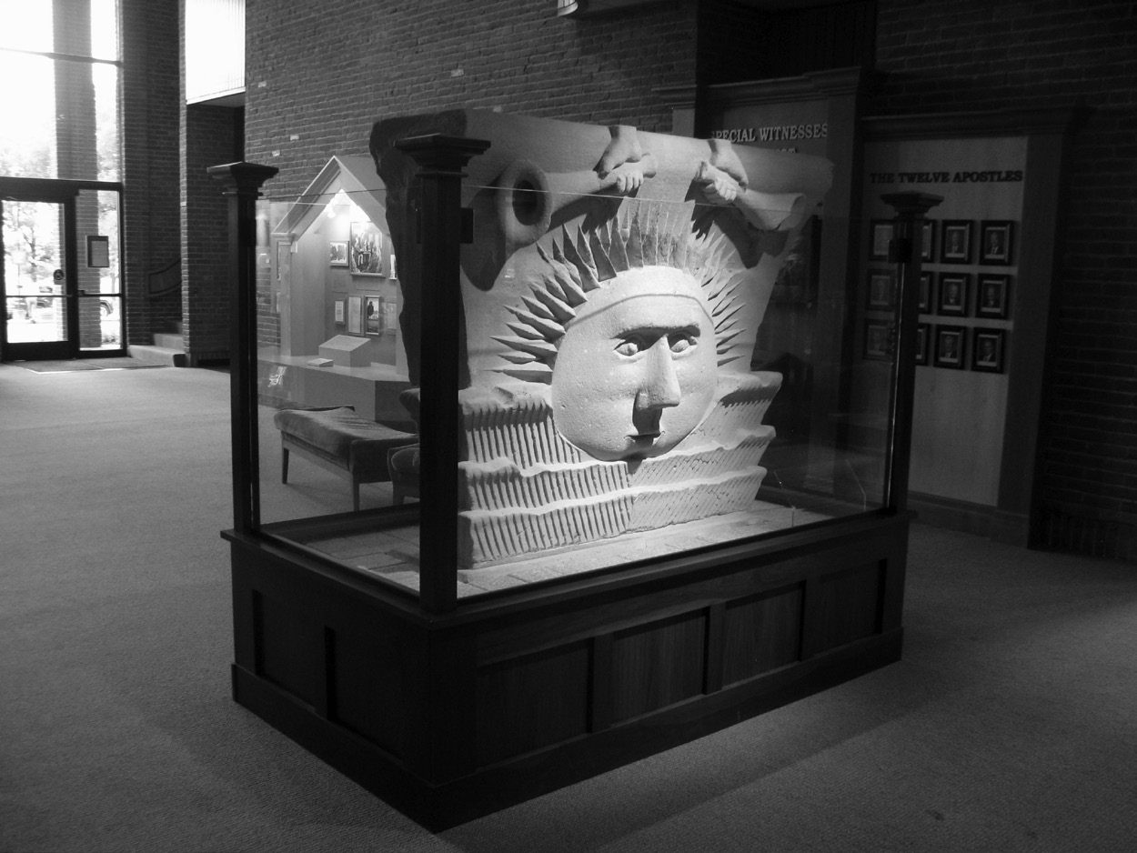 Figure 10. Sunstone from the original Nauvoo Temple. Following the destruction of the temple, this sunstone was one of two sunstones procured by George W. Gray in 1865 and taken to Quincy, Illinois, where it was displayed on the grounds of the Methodist College. It was later moved to the state capital in Springfield, Illinois, and displayed on the capitol grounds of the old and current state capitol buildings and on the Illinois State Fairgrounds. In 1955 it was moved to the Nauvoo State Park. The Church of Jesus Christ of Latter-day Saints became the custodian of the stone in 1992. Photograph by author, 2013.